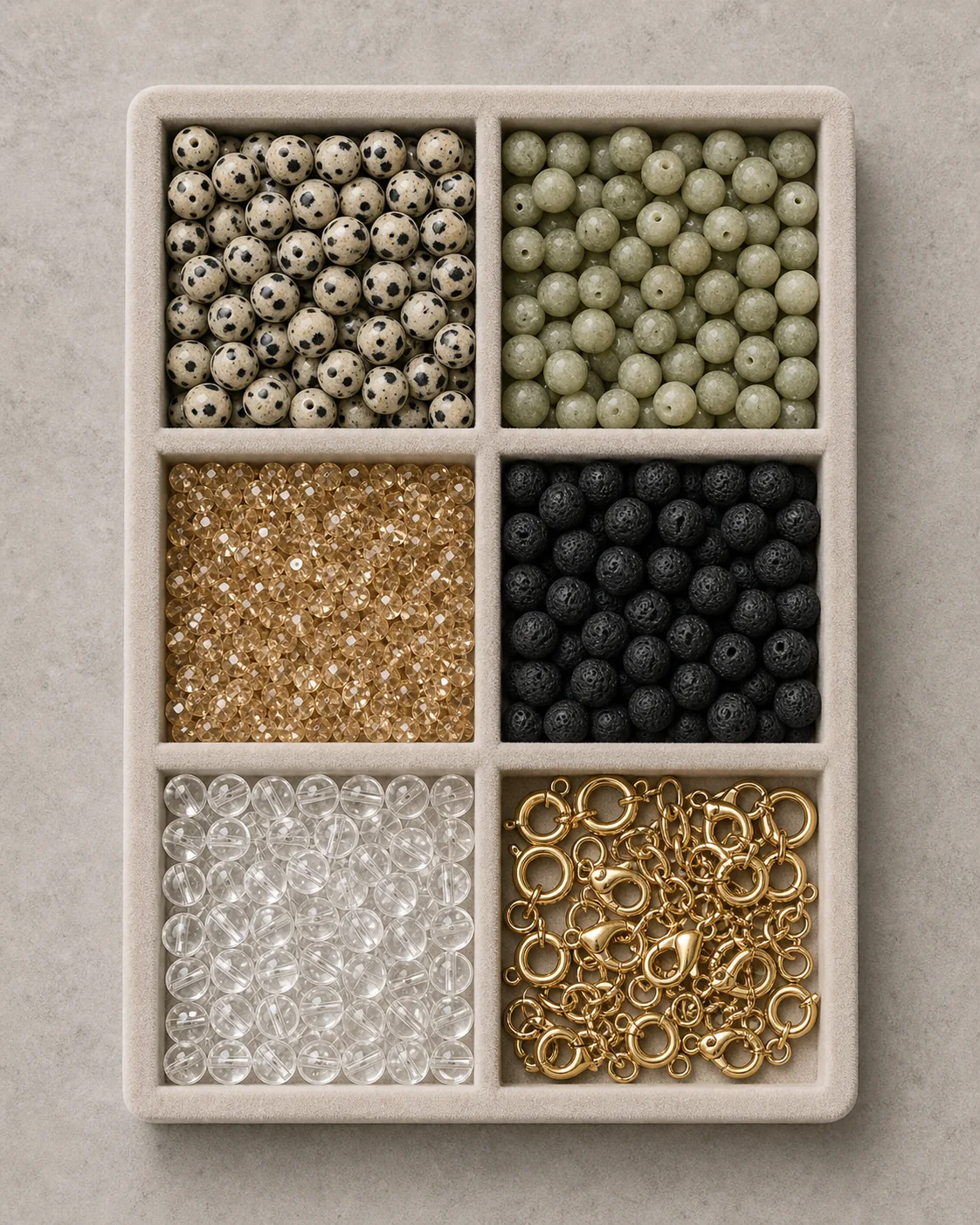 Six-compartment sample tray with jasper, jade, crystal, lava, clear and gold components